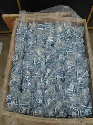 Bent hitch pins packed in a wooden export crate