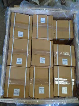 Cartons of tractor parts packed for export