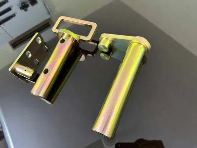 Yellow zinc-plated pins with locking plates and handles